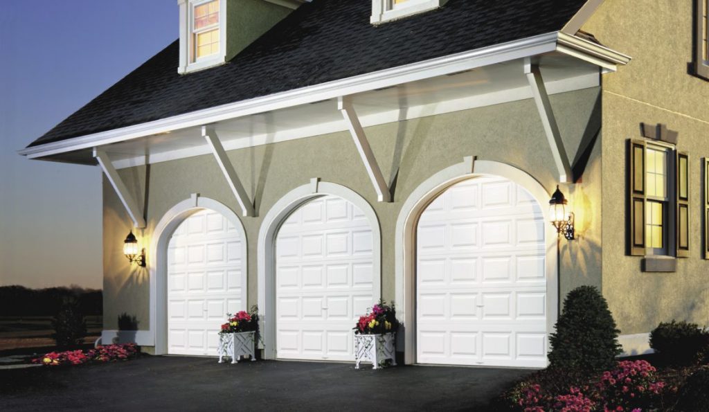 Three white garage doors with arches